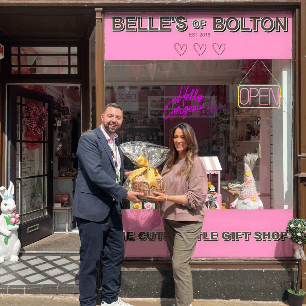 a photo of Michele, owner of Belle's of Bolton with her Community Favourite Independent Retailer Prize